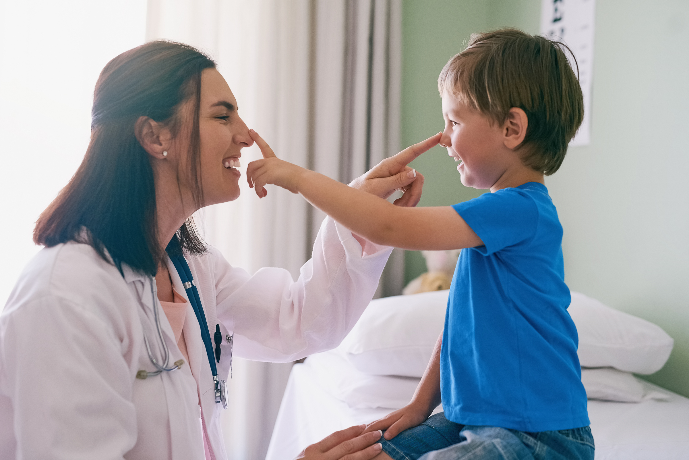 S2S Global: woman doctor with child in blue shirt